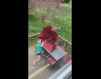 Girl red table umbrella loses control wind