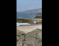 Woman bikini kneel and arch body beach