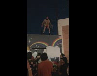 Man in padded suit jumps into concert audience