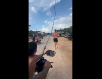 Man runs while kid whips his back