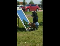 Black shirt girl takes mirror photos outside 