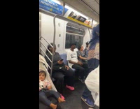 Man on subway train wearing funny shirt 