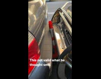 Guy Finds Cone in Between His and Another Car 