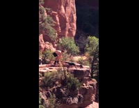 Woman white top push up lowered rock 