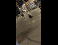 Guy cap black jacket breakdance street night