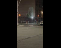 4 people play small tennis on sidewalk