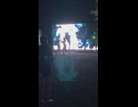 Couple dance in front of LED wall 