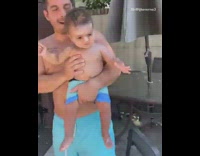 Boy makes ring on hook game