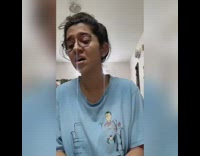 Girl plays piano sings puppy presses keys 