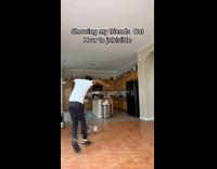 Guy jubislide dance slide around a cat