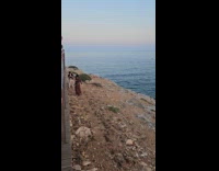 Woman brown dress beach side dance video