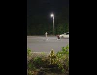 girl nighttime middle of road