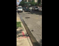 Lambourghini sports car on a single lane road blocking traffic