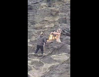 Woman headdress hold ring with fire beach