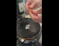 Brown small egg cracked and cooked in the pan