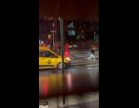 Collab WINY - Person in Elmo costume crosses the road