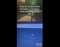 Girl on laptop playing dinosaur game 