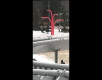 Woman red bars swing pants down snow