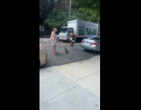 Bird stand next to woman with broom