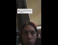 Guy with long hair reads comment 