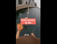 Guy runs across posts holding pizza