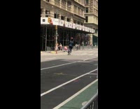 Guy on bike balances basketball on his head 