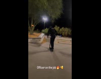 Cop rides scooter does stunt on ramp