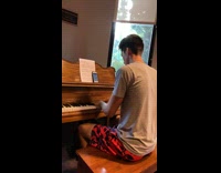 Man plays piano and the Nintendo wii theme song