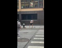 White shirt guy plays flute fire hydrant 