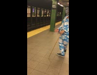 Guy blue cloud suit dances cane subway 