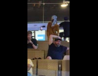 Woman satin outfit dances at the airport