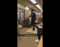 Guy tap dances in train