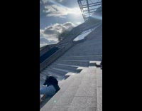 Two women hold hands ran then fell on the stairs