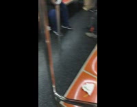 Line of mustard on orange subway train seats