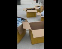 Guy deals masks out of white truck 