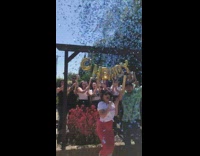 Pregnant wife and husband have a gender reveal party with blue confetti cannon