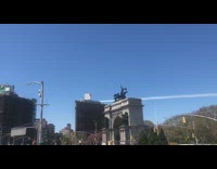 airplanes over city from washington square arch