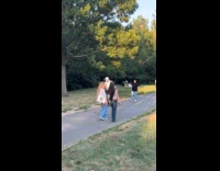Guy wears armor costume walk at park