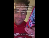 Guy eats red rope candy 