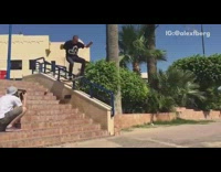 Collab ShredSlams - Skater grinds on blue staircase rail with skateboard and lands hard on tailbone