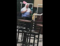 Guy dressed as rabbit vlogs at Mcdonalds