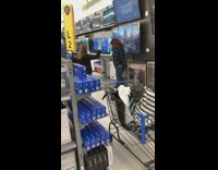 Girl poses in front of TV screensaver 