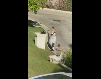 Jogger girl hold dog leash dance street