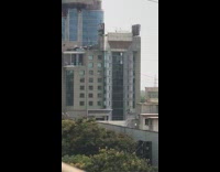 Large Blue Building on Fire in India