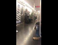 Guy riding subway wears christmas tree with lights 
