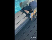 Guy grabs boys pants pretends to push in pool