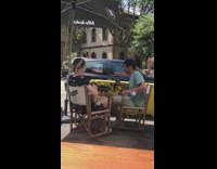 Guy takes photos of food at restaurant 