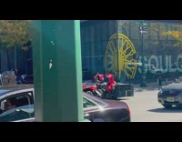 Red sports car drives on the road at day in NY 