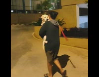 Black sweater guy carries puppy like baby