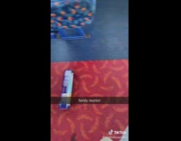 Can of biscuits rolling down red floor of bus 